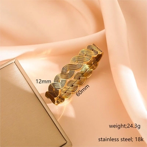 18K gold plated stainless steel bracelet featuring an elegant wavy braided texture
