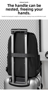 Black travel backpack with luggage strap fixed on silver suitcase handle
