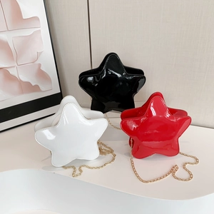 Three trendy star-shaped crossbody chain bags in black, white, and red glossy finish