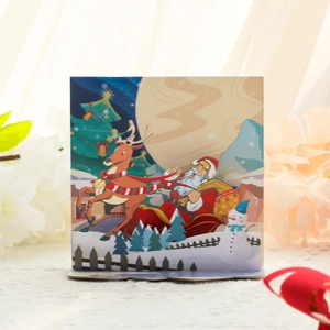 3D pop up Christmas card featuring Santa Claus in a sleigh with reindeer and snowmen