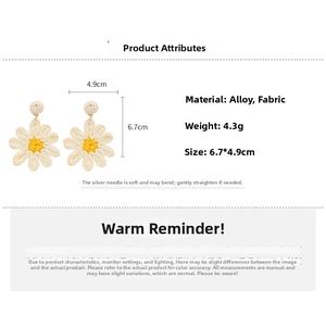 Detailed view of handmade woven daisy earrings showing size 6.7x4.9cm and 4.3g weight
