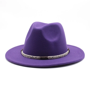 Detailed macro view of purple wool felt hat with decorative braided rope band and buckle