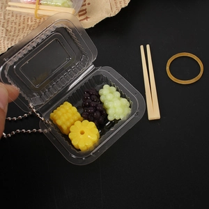 Mini dollhouse fruit box toy with resin grapes and pineapple on a vintage background