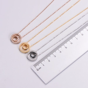 Intertwined double ring pendant necklaces in rose gold, gold, and silver with zircons