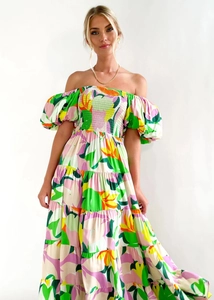 Detailed view of the puff sleeves and pleated bust on this floral off-shoulder maxi dress