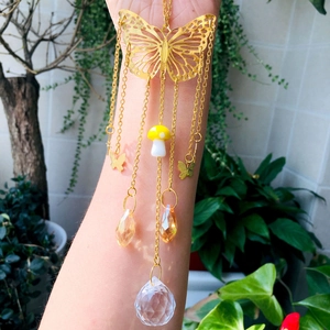 Golden butterfly suncatcher with crystal ball and mushroom pendant for garden decor