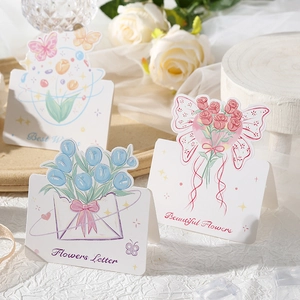 Detailed view of floral greeting cards with Best Wishes and Beautiful Flowers prints