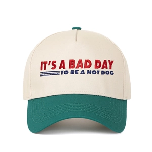 Retro cream and dark green baseball cap with IT'S A BAD DAY TO BE A HOT DOG embroidery