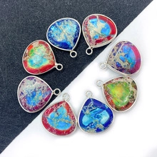 Colorful heart-shaped natural stone pendants with silver borders in circular arrangement