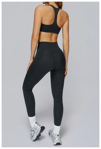 Detail view of charcoal grey high-waist yoga set with racerback bra and textured fabric