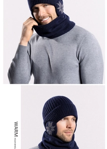 Close-up of navy blue thermal knit hat with earflaps and neck warmer for winter warmth