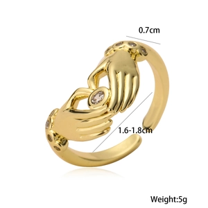 Adjustable 18K gold plated hands hugging heart ring with white cubic zirconia accents