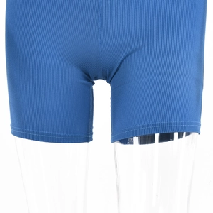 Detailed close-up of blue ribbed knit shorts showing hem stitching and fabric texture