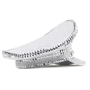 Detail of silver sequined party hat featuring dense rhinestone and stud embellishments