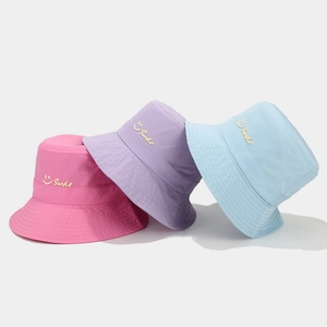 Three colorful smile embroidered quick-dry sun hats in rose, purple and blue colors