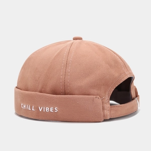Dusty pink cotton docker hat with white Chill Vibes embroidery and adjustable back strap