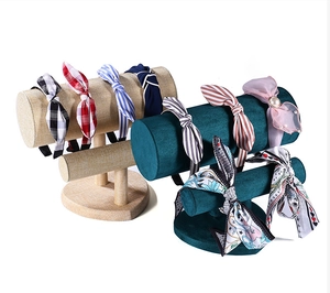 Close-up of headband display stand with various colorful fabric and pearl headbands