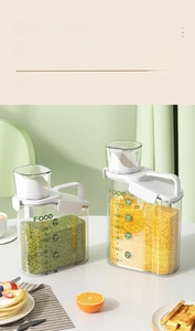 Detail of clear food storage containers showing green beans and millet with scales