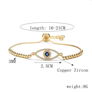 Detail of gold evil eye bracelet with blue zircon and size specifications in inches