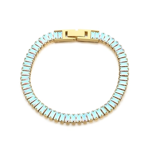 Gold tennis bracelet with rectangular light blue opal stones on a clean white background