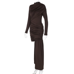 Detail view of the ruched design and asymmetrical hem on this dark brown long sleeve dress