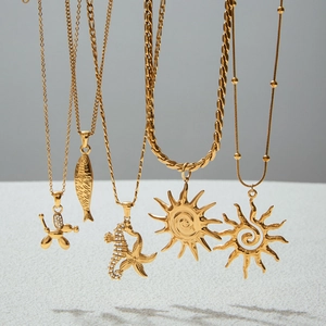 Detailed showcase of five gold-plated stainless steel necklaces with distinct summer charms