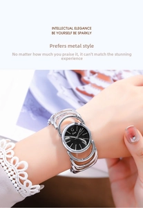 Elegant silver bracelet watch with black dial shown on a woman wrist for daily wear