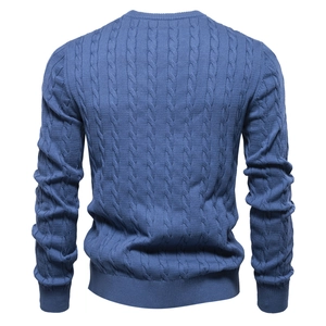 Detail view of the back of a blue cable-knit men's sweater with high-quality texture