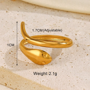 Macro shot of adjustable gold snake ring with 1cm width and textured detail