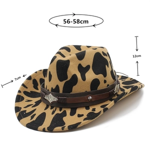 Detail view of thickened cow print cowboy hat with vintage silver floral ornaments