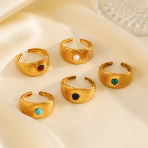 Set of five gold stainless steel adjustable rings featuring diverse natural stone inlays