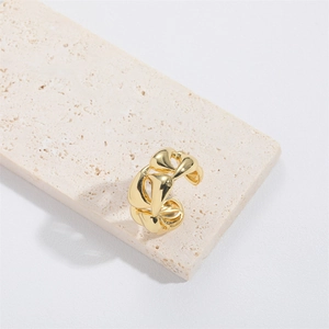 Polished gold adjustable chain ring with geometric link design on white stone