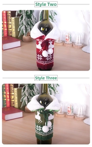 Detail of Christmas reindeer knitted wine bottle covers with faux fur trim and pom-poms