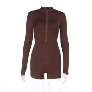 Detail of slim fit brown romper showing front zipper and structural stitching lines