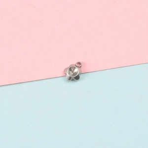 Detailed view of flower shaped silver stainless steel pendant tray for DIY jewelry making