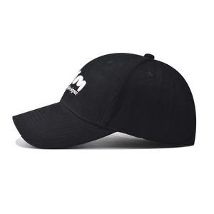 Detail of white M Designer 3D embroidery on black cotton twill baseball cap