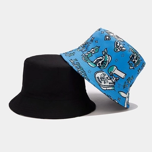 Detail of reversible bucket hat in black cotton and blue street style graphic print