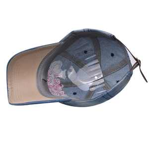 Internal view of denim baseball cap with brown leather strap and metal buckle