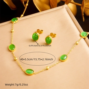 Gold stainless steel jewelry set with oval green stones including necklace and earrings