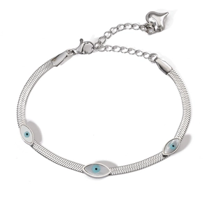 Detail of silver snake chain bracelet featuring evil eye charms and a heart pendant