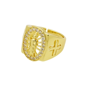 Detailed view of golden ring with relief figure, sparkling rhinestones, and side cross