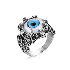 Detailed close-up of gothic punk skull ring featuring a blue evil eye in vintage silver