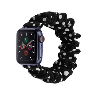 Detail shot of black and white polka dot scrunchie strap for Apple Watch