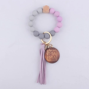 Silicone beaded keychain bracelet featuring a leather tassel and MAMA wooden tag charm pendant.