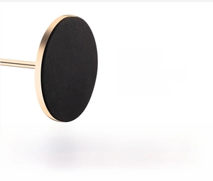 Close-up of gold candle holder base with non-slip matte pad to prevent scratches