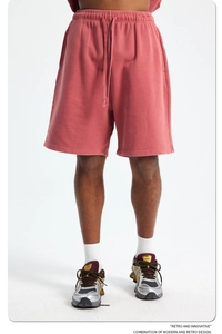 Detail of vintage red cotton gym shorts featuring an elastic drawstring waistband and texture