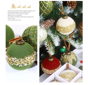 Close-up of 8cm flocked Christmas balls with gold beads and mesh details in a gift set
