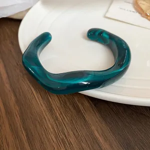 Elegant emerald green resin open bangle with irregular wavy marble texture pattern