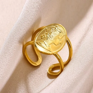Macro shot of gold 18K plated stainless steel ring with vintage oval portrait carving