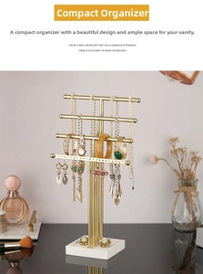 Detail view of a 4-tier golden jewelry stand for necklaces and earrings on a vanity